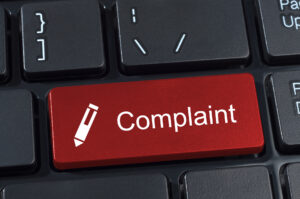 Complaint button keyboard with pen icon.